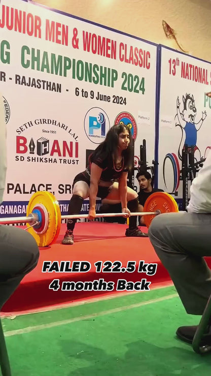 A powerlifter using liquid chalk
